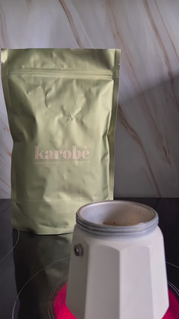 The complete Karobe preparation ritual: filling the moka pot, watching the dark brew rise, and pouring the caffeine-free alternative.